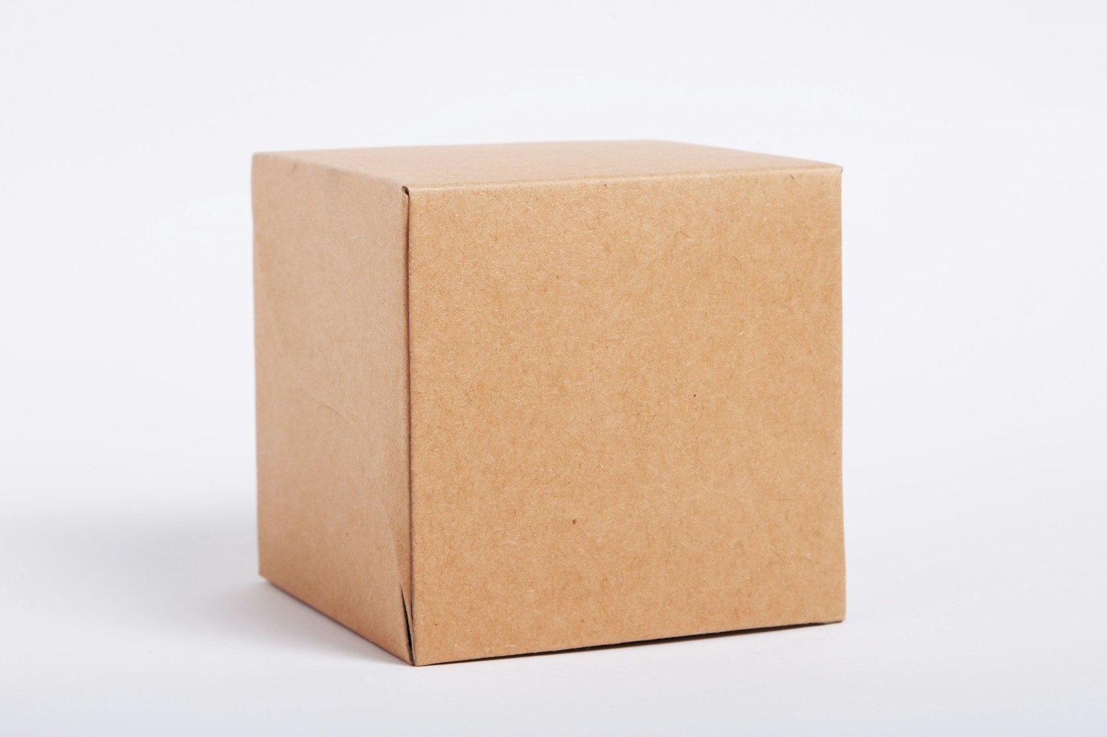 A plain cardboard shipping box on a white background